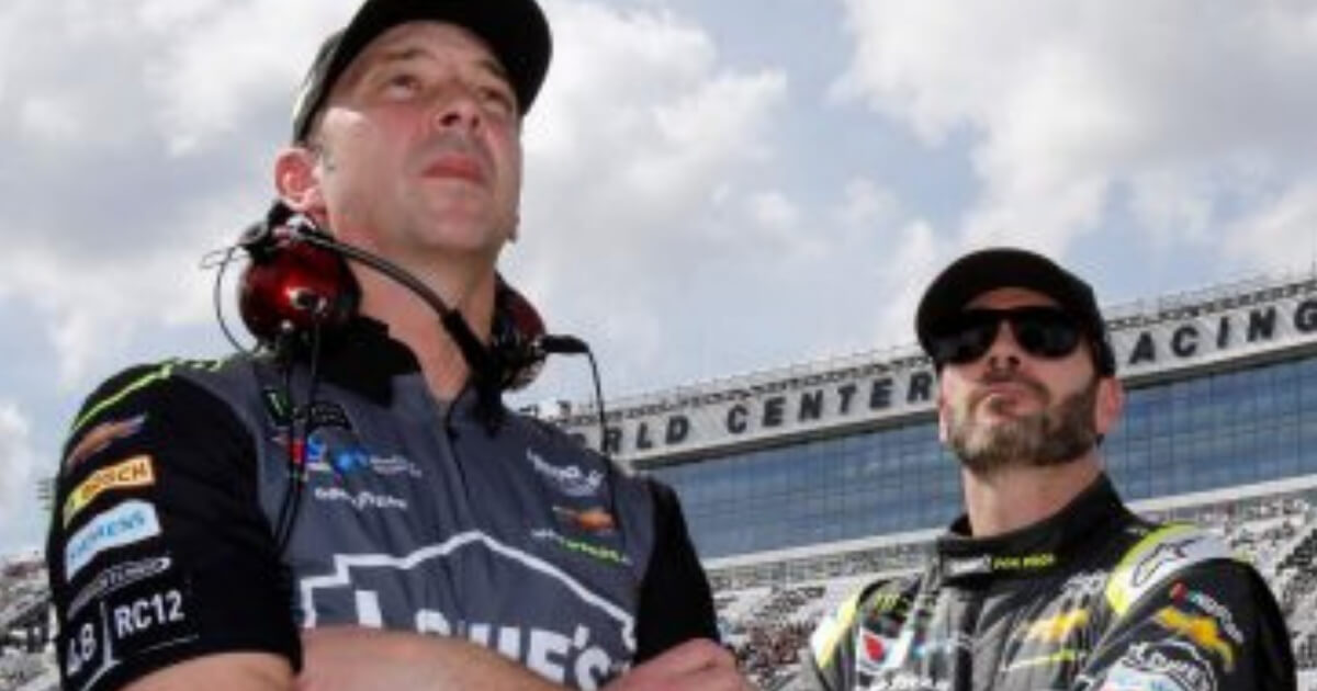 Crew chief Chad Knaus, left, and Jimmie Johnson watch the leaderboard during qualifying for the Daytona 500 in February.