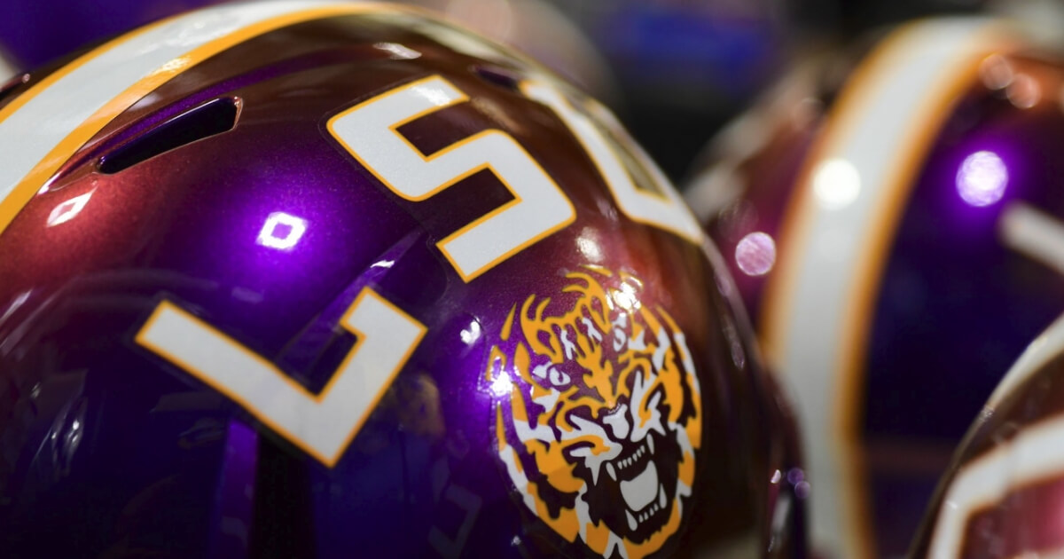 The helmets with LSU's 2018 uniform change color from purple to gold under the stadium lights.