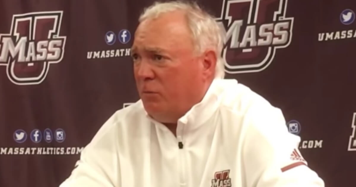 UMass head coach Mark Whipple talks to the media.