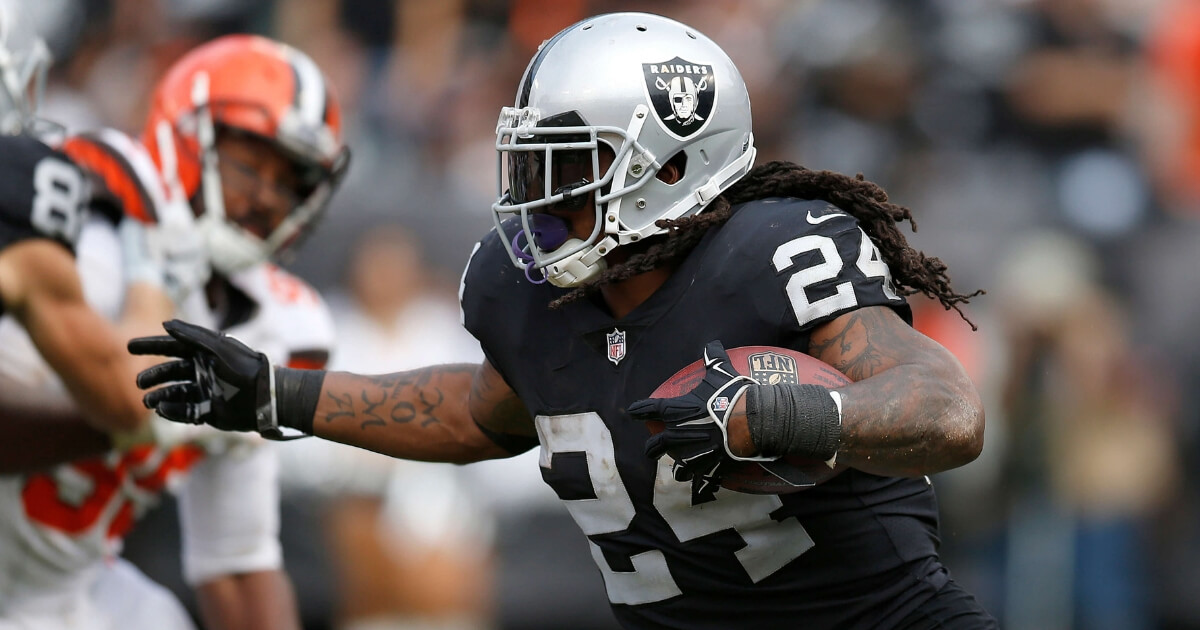 Oakland Raiders running back Marshawn Lynch carries against the Cleveland Browns during a Sept. 30 game in Oakland. A person familiar with the injury says Lynch will miss at least a month with an injured groin. An MRI this week determined the severity of the injury that was first reported by NFL Network.