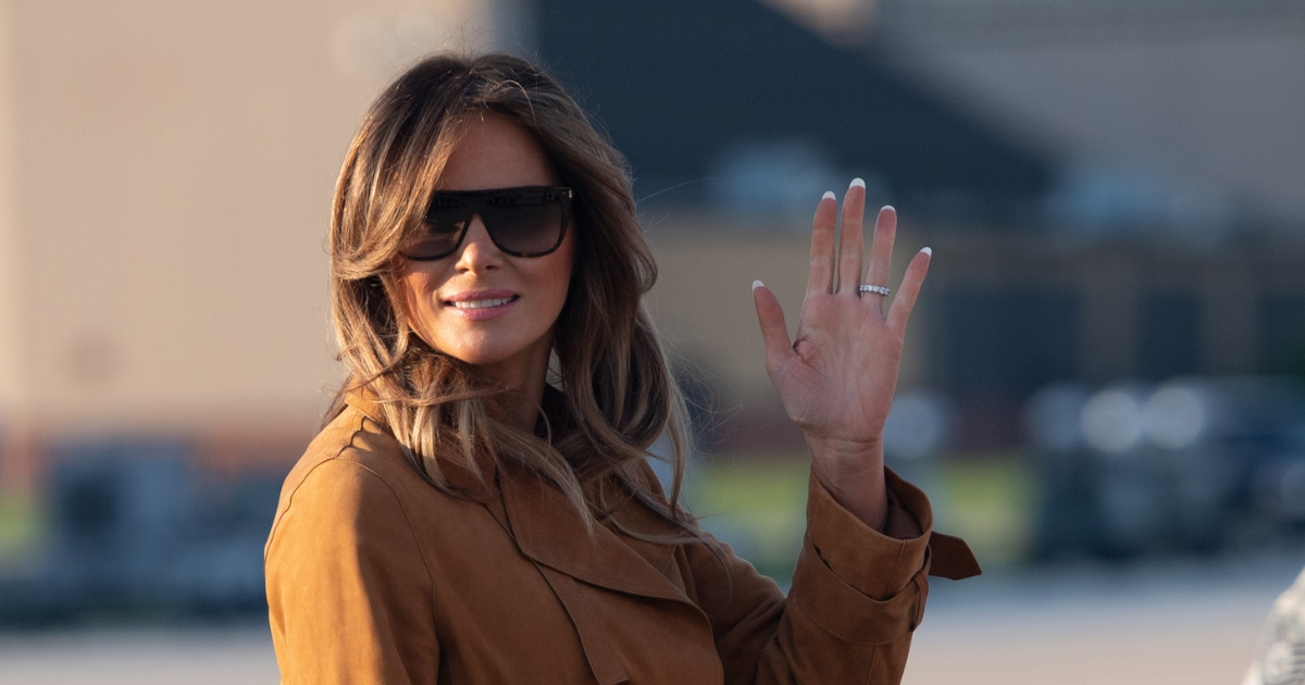 First lady Melania Trump waves to onlookers Oct. 1 as she departed for a trip to Africa.