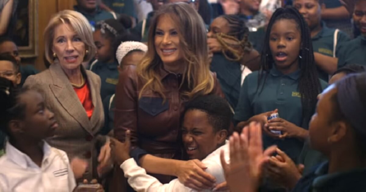 First lady Melania Trump hugs students from the charter school Digital Pioneer Academy during the studednts' visit to the White House last week.