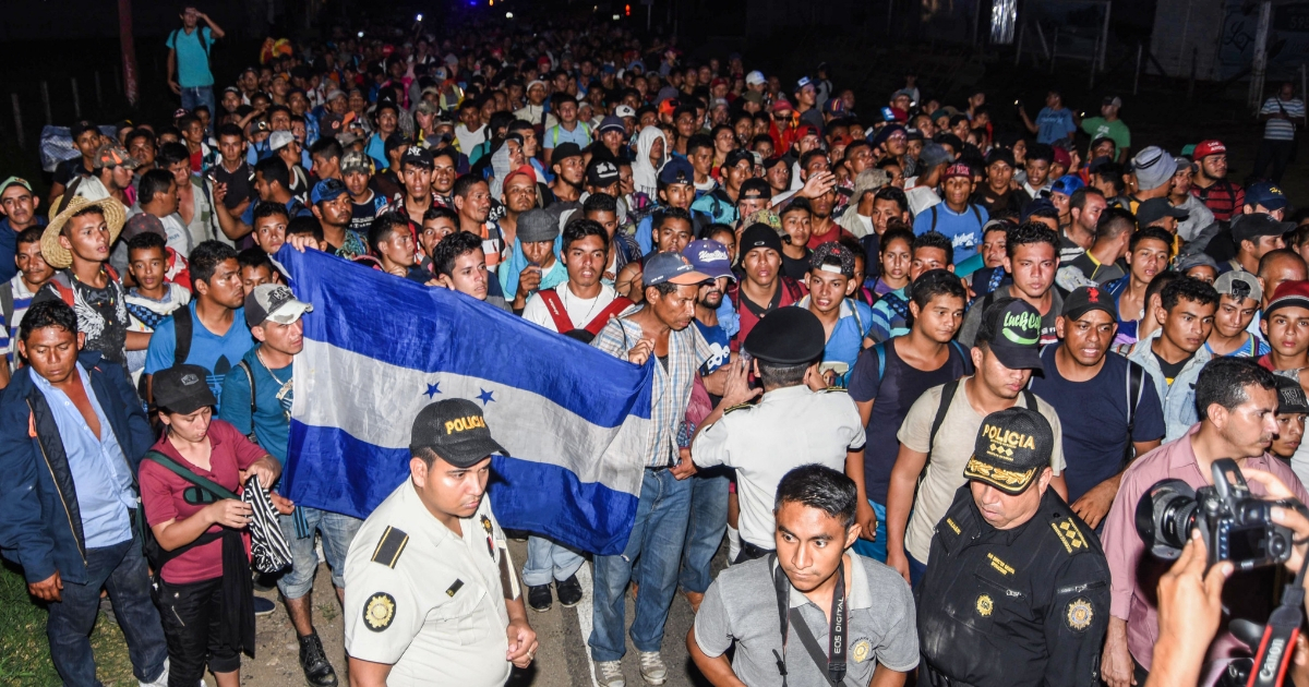 Honduran migrants headed for the U.S. border march through Chiquimula, Guatemala, on Monday.