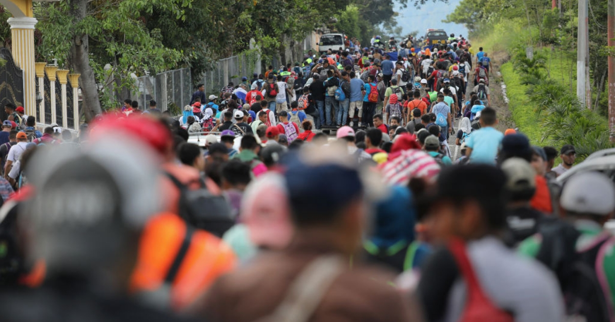 A caravan of more than 1,500 Honduran migrants moves north after crossing the border from Honduras into Guatemala