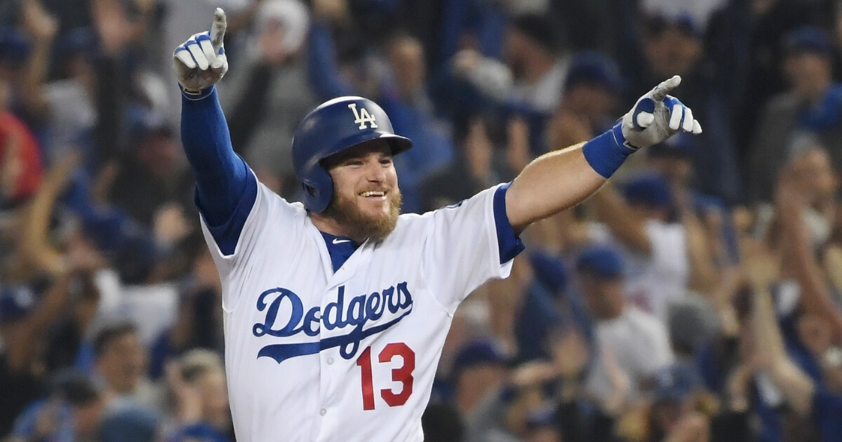 Max Muncy of the Los Angeles Dodgers celebrates his 18th-inning walk-off home run to defeat the the Boston Red Sox 3-2 in Game 3 of the World Series at Dodger Stadium on Friday.