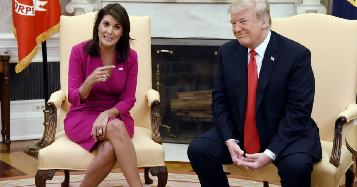 Outgoing U.N. Ambassador Nikki Haley and President Donald Trump meet with reporters in the Oval Office on Tuesday.