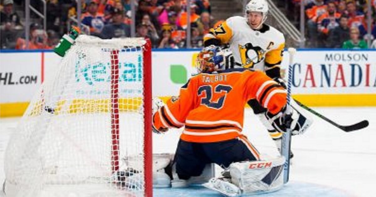 Edmonton Oilers' goaltender Cam Talbot reacts as Pittsburgh Penguins' Sidney Crosby scores during the first period Tuesday in Edmonton, Alberta.