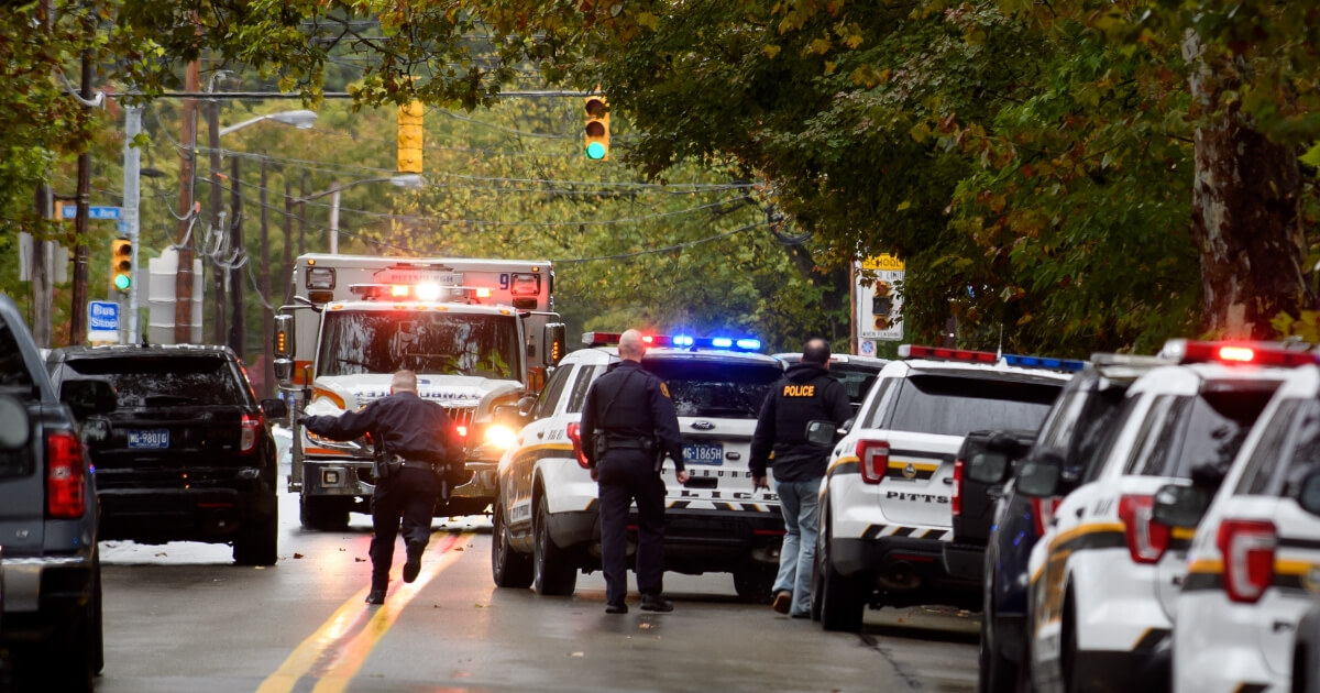 Police officers respond to the site of a mass shooting at the Tree of Life Synagogue in the Squirrel Hill neighborhood of Pittsburgh on Saturday.