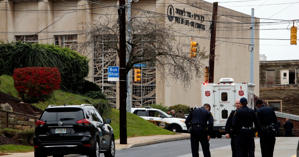 First responders stand outside the Tree of Life Synagogue in Pittsburgh, where a shooter opened fire Saturday.