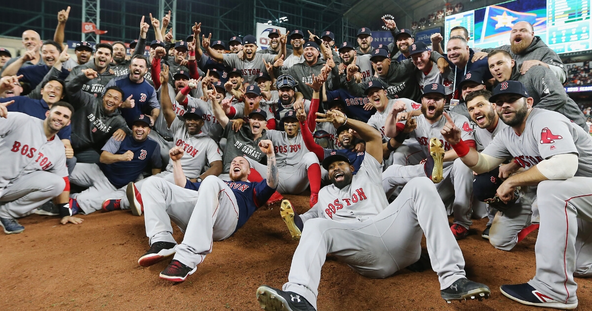 The Boston Red Sox celebrate Thursday at Minute Maid Park after defeating the Houston Astros 4-1 in Game 5 of the AL Championship Series to advance to the World Series.