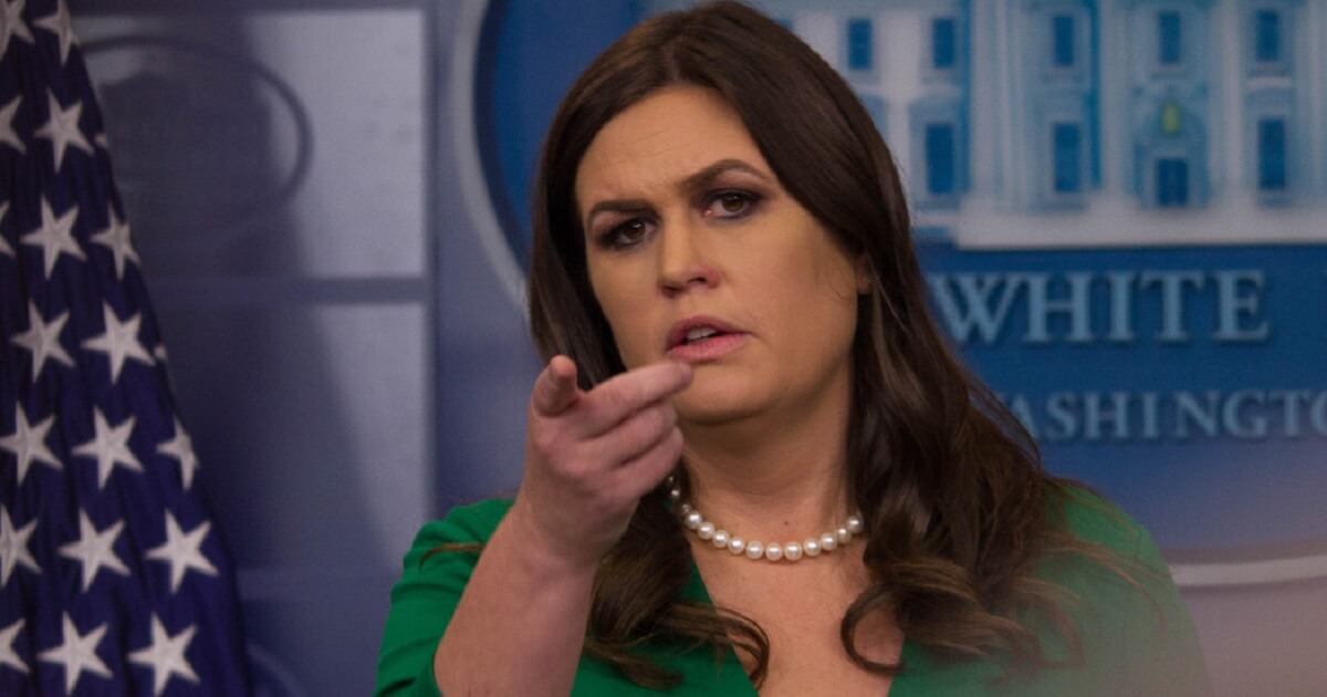 White House press secretary Sarah Sanders fields questions from the podium in a file photo from Oct. 27, 2017.