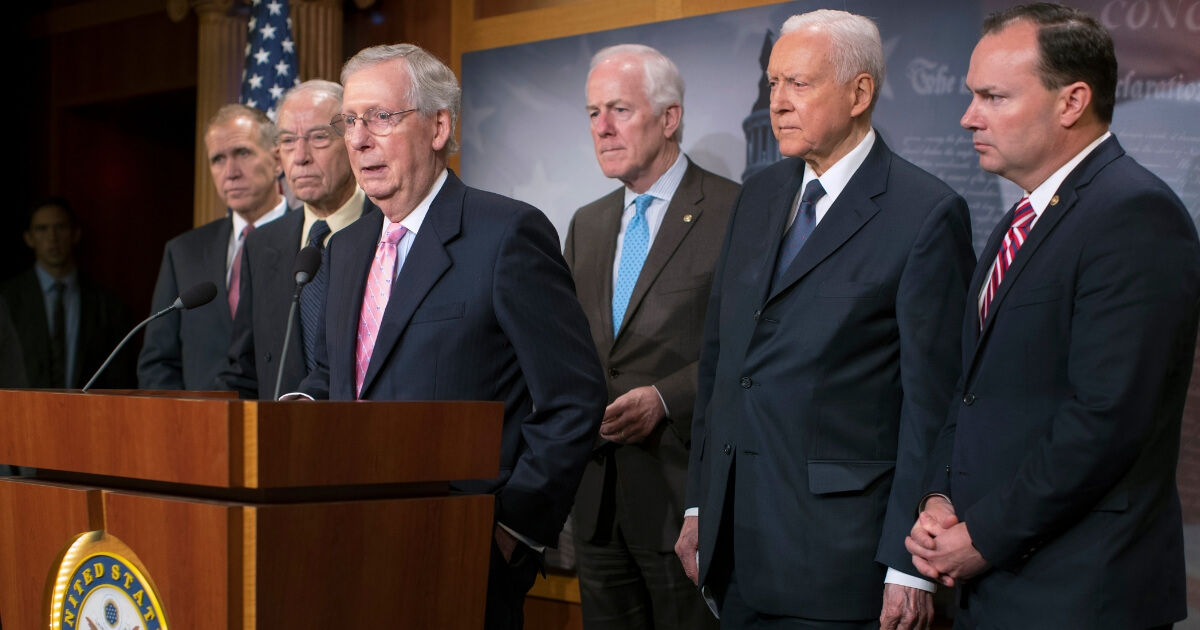 Senate Majority Leader Mitch McConnell (R-KY) (3rd L) joins Republican members of the Senate Judiciary Committee to discuss this week’s FBI investigation into Supreme Court nominee Judge Brett Kavanaugh during a news conference at the U.S. Capitol Oct. 04, 2018, in Washington, D.C.