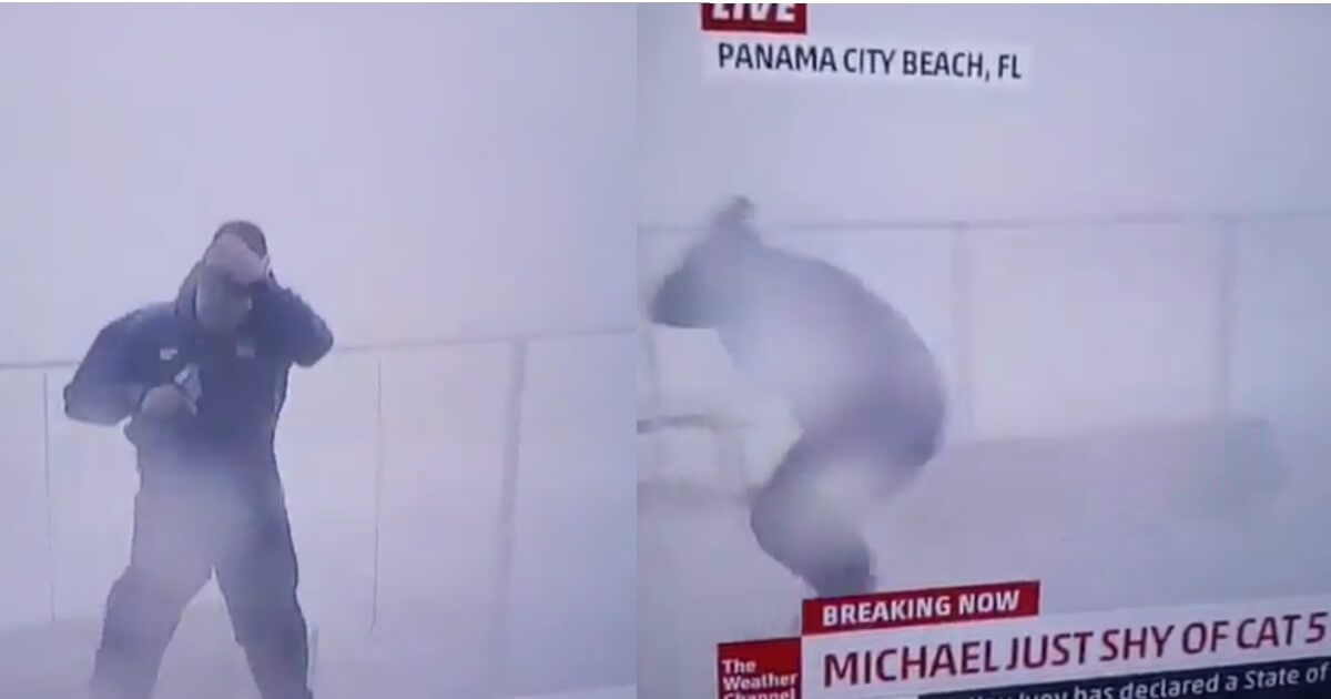 A weather reporter in Hurricane Michael narrowly avoids incoming debris.