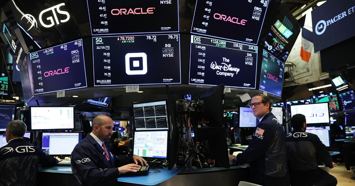 Traders work on the floor of the New York Stock Exchange