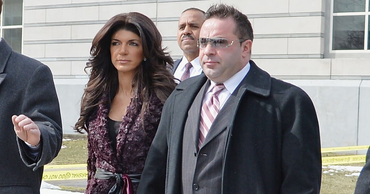 Teresa Giudice (L) and Joe Giudice leave court after facing charges of defrauding lenders, illegally obtaining mortgages and other loans as well as allegedly hiding assets and income during a bankruptcy case on March 4, 2014, in Newark, New Jersey.