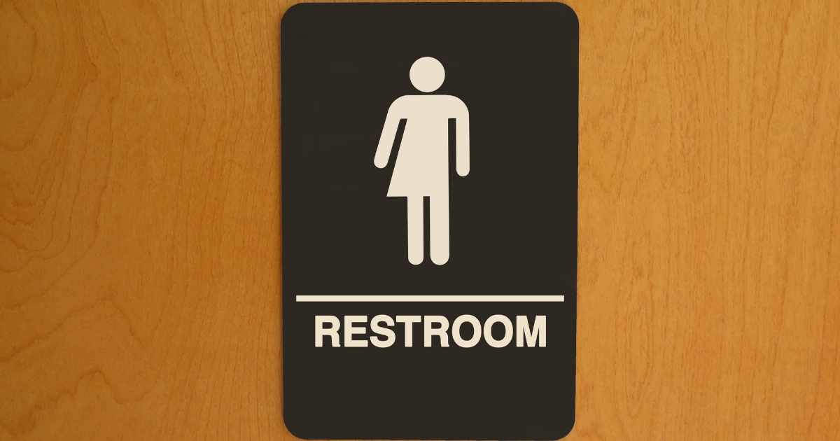 A sign indicates a public restroom is gender neutral.