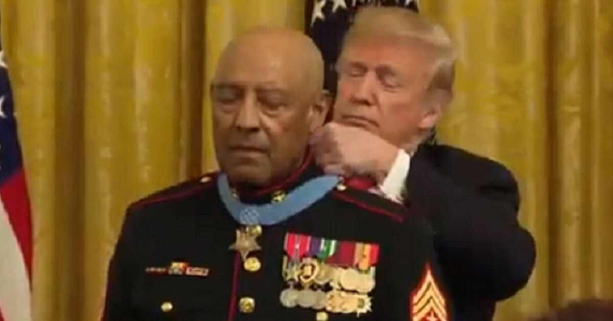 President Donald Trump presents retired Marine Sgt. Maj. John Canley with the Medal of Honor Wednesday in a ceremony at the White House.