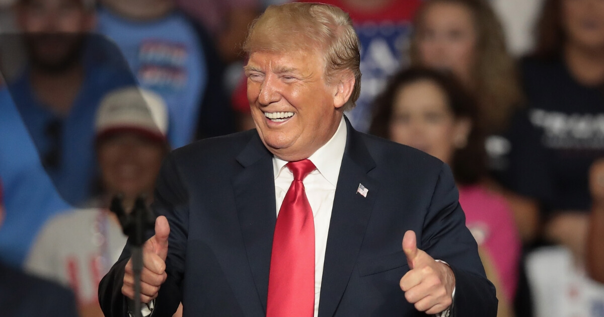 President Donald Trump smiles as he takes the stage at a Sept. 6 rally in Billings, Montana.