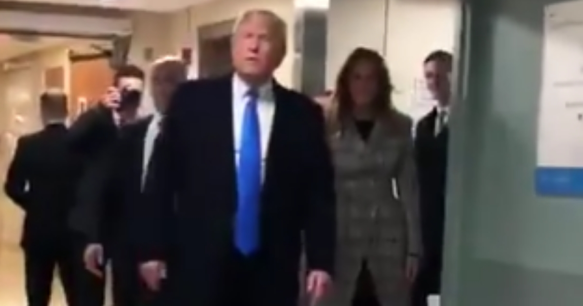 Donald Trump and the first lady walking over to doctors in hospital.