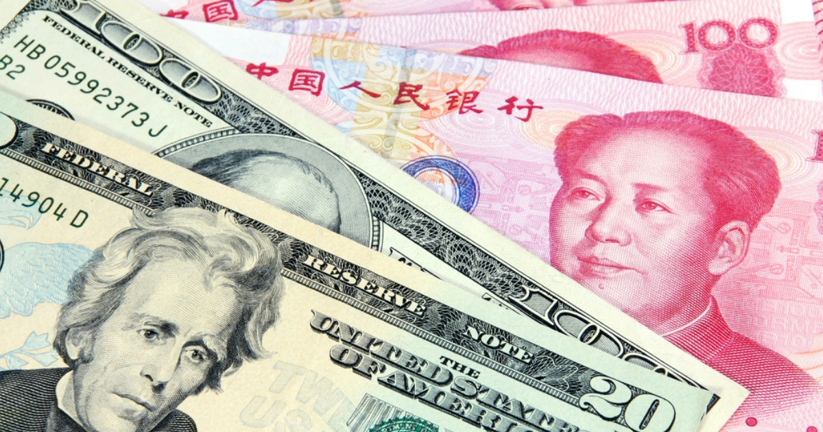 U.S. currency alongside Chinese currency