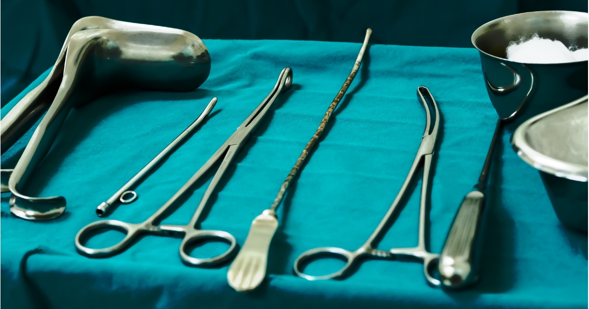 Sterile curettage tools, forceps, retractor in operation room at medical hospital for abortion.