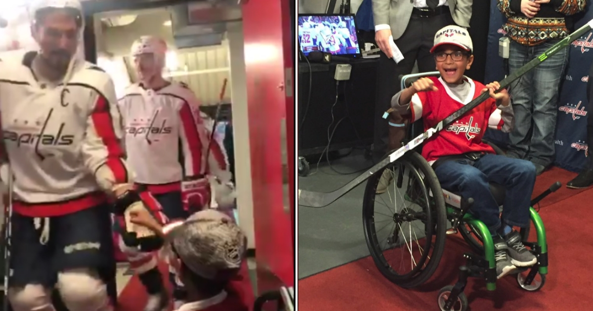 Young boy in wheelchair is given a hockey stick by Alex Ovechkin