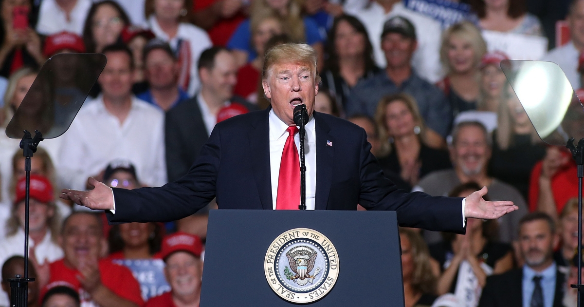 President Donald Trump speaks to a crowd of supporters during a rally at the International Air Response facility on October 19, 2018 in Mesa, Arizona