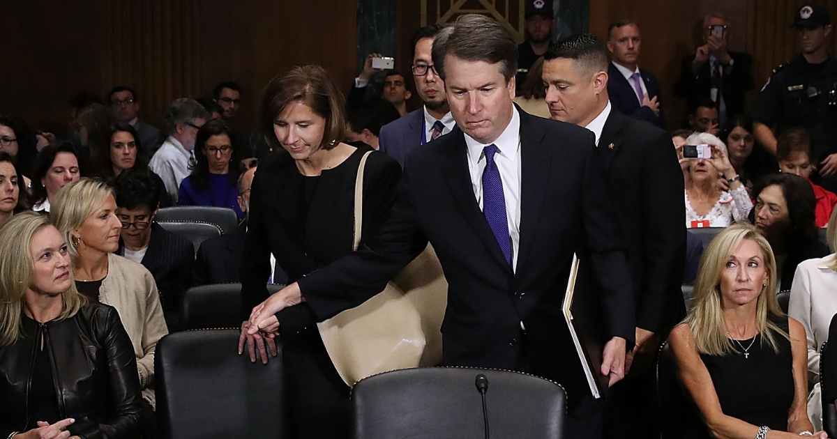 udge Brett Kavanaugh (C) holds hands with his wife Ashley Kavanaugh as he arrives to testify to the Senate Judiciary Committee.