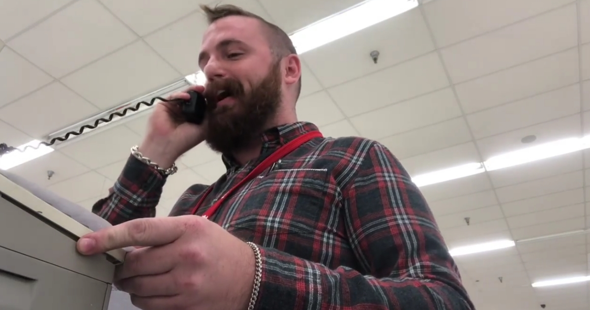 Man speaking on Kmart loudspeaker.