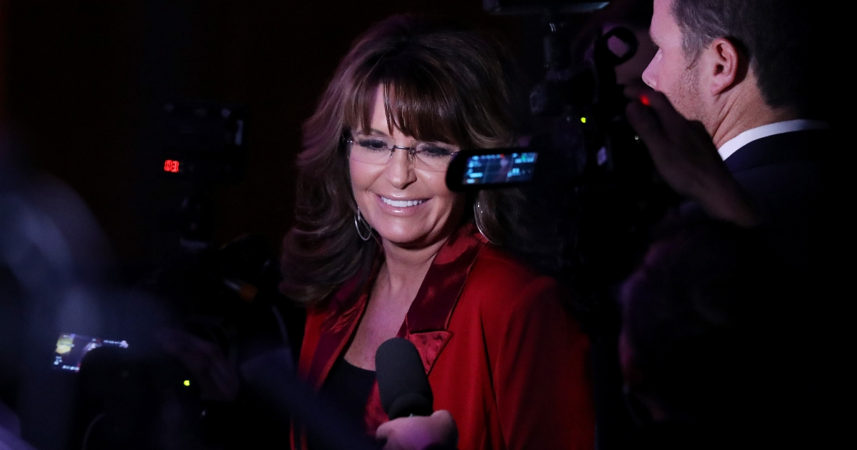 Sarah Palin talks to reporters. (