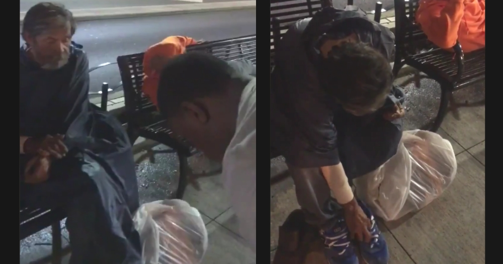 Man gives homeless man his shoes.