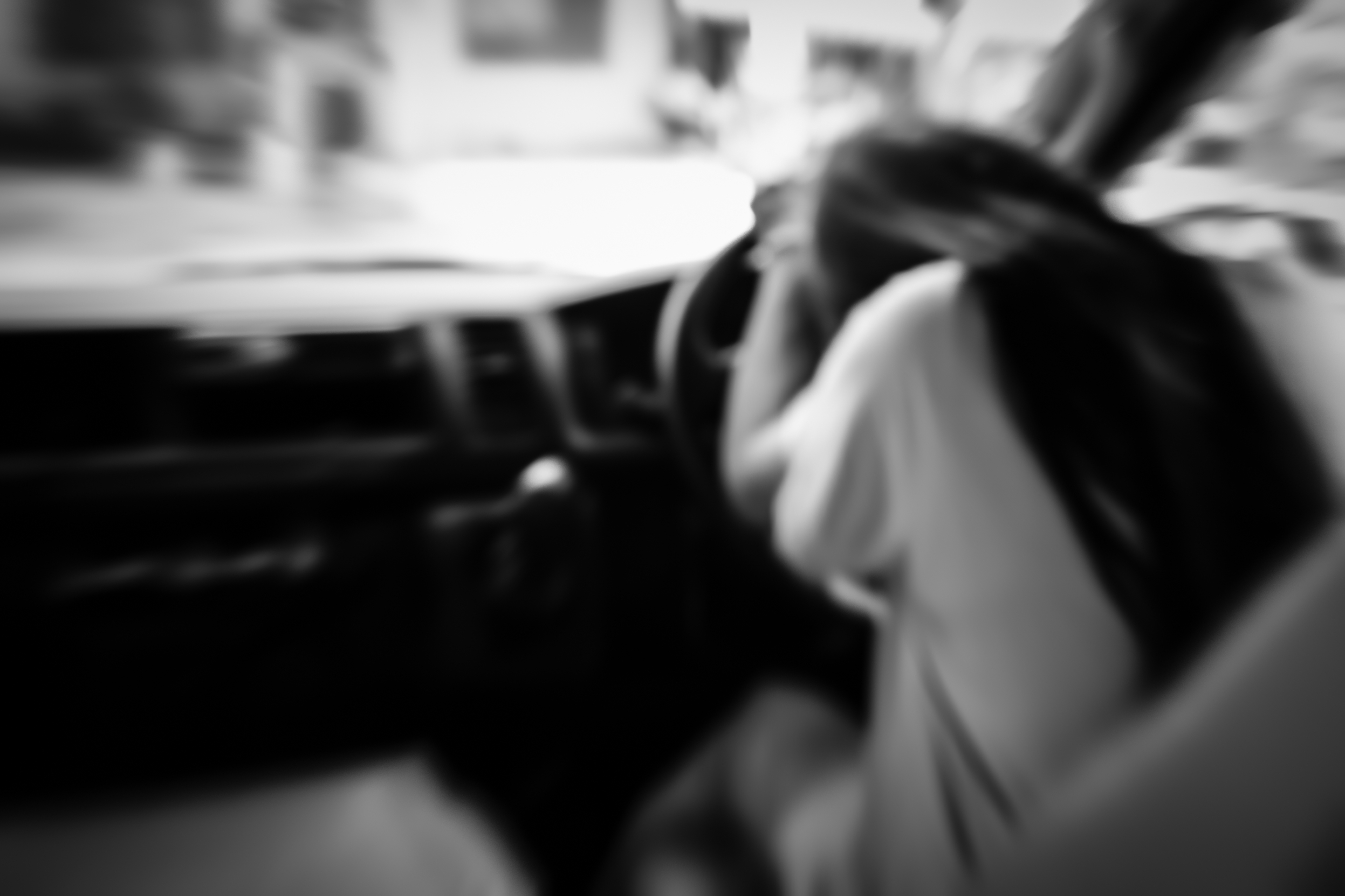 Sad woman in car,blurry emotion black and white.