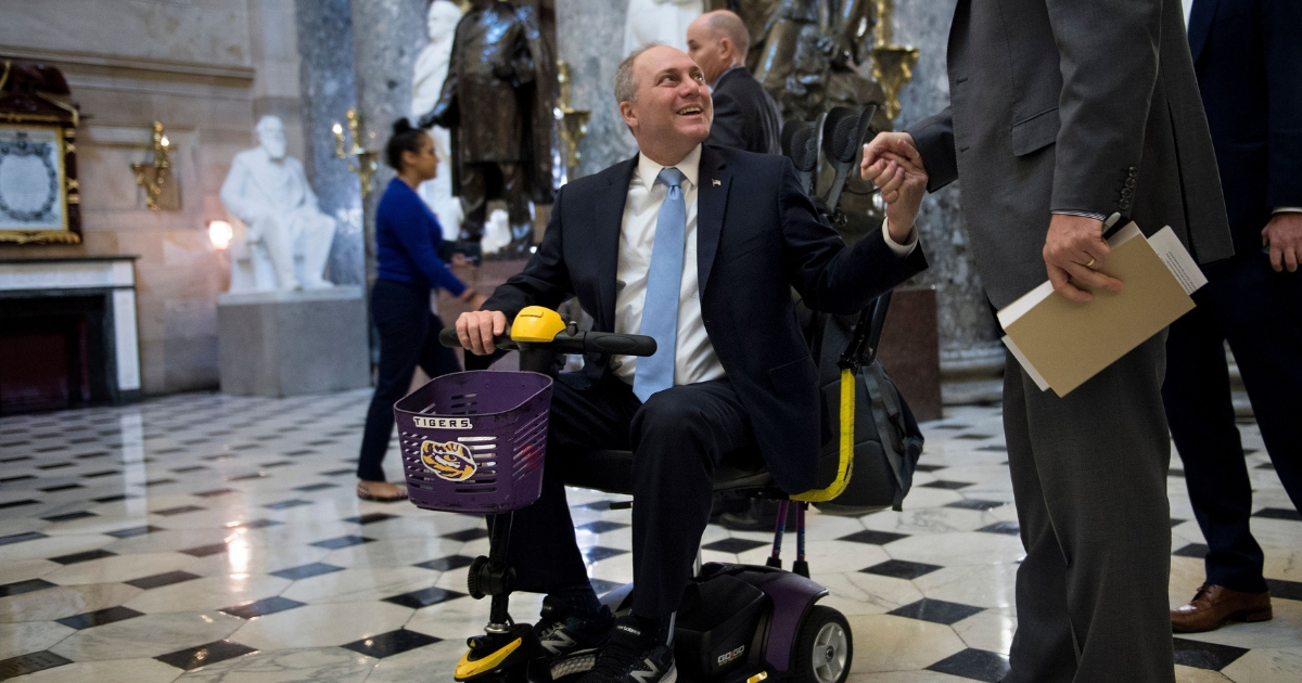 House Majority Whip Steve Scalise is greeted before a vote on tax legislation on Capitol Hill December 20, 2017 in Washington, D.C.