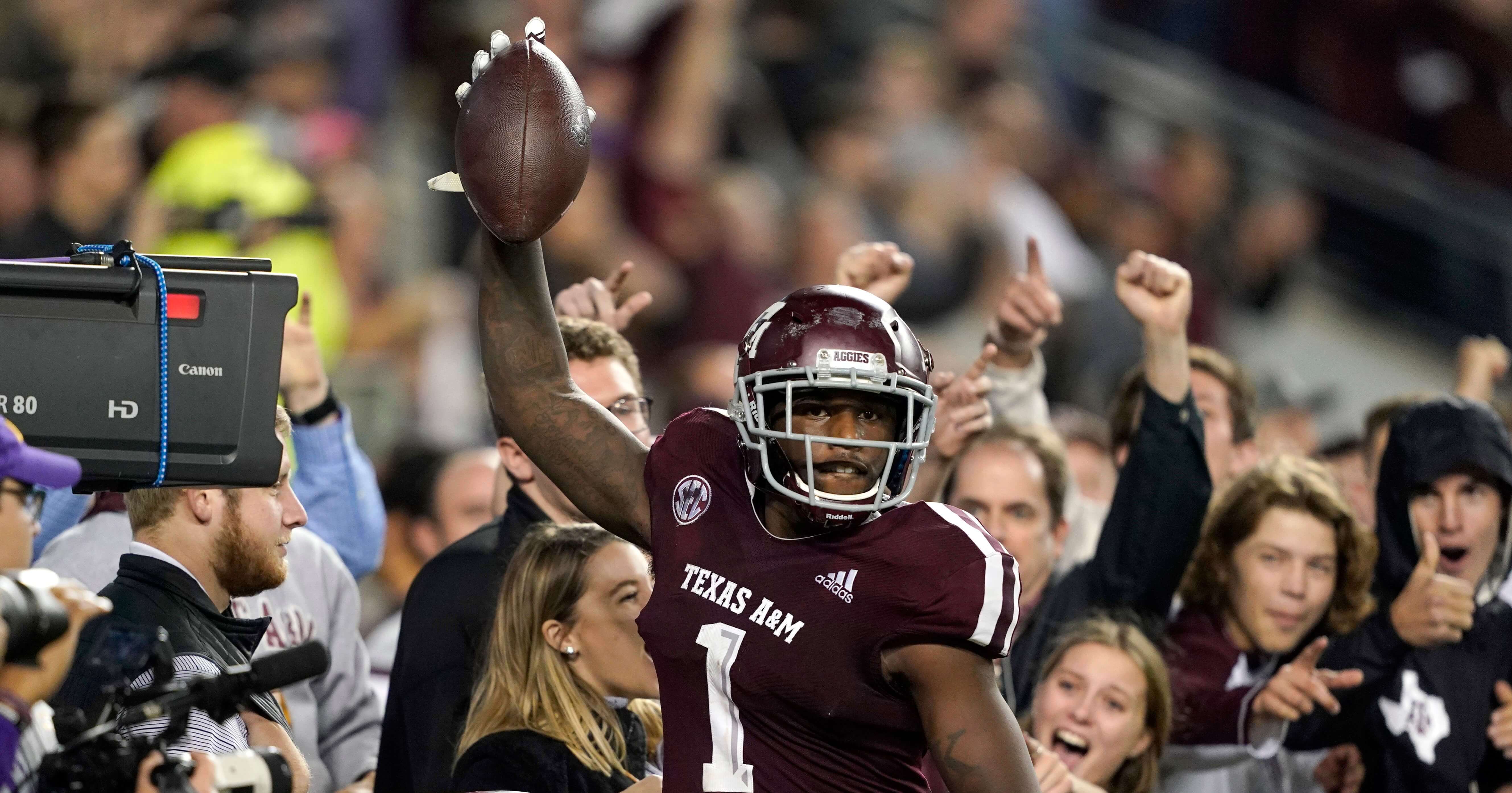 Texas A&M wide receiver Quartney Davis celebrates after catching a touchdown pass during the seventh overtime of Saturday's game against LSU in College Station, Texas.