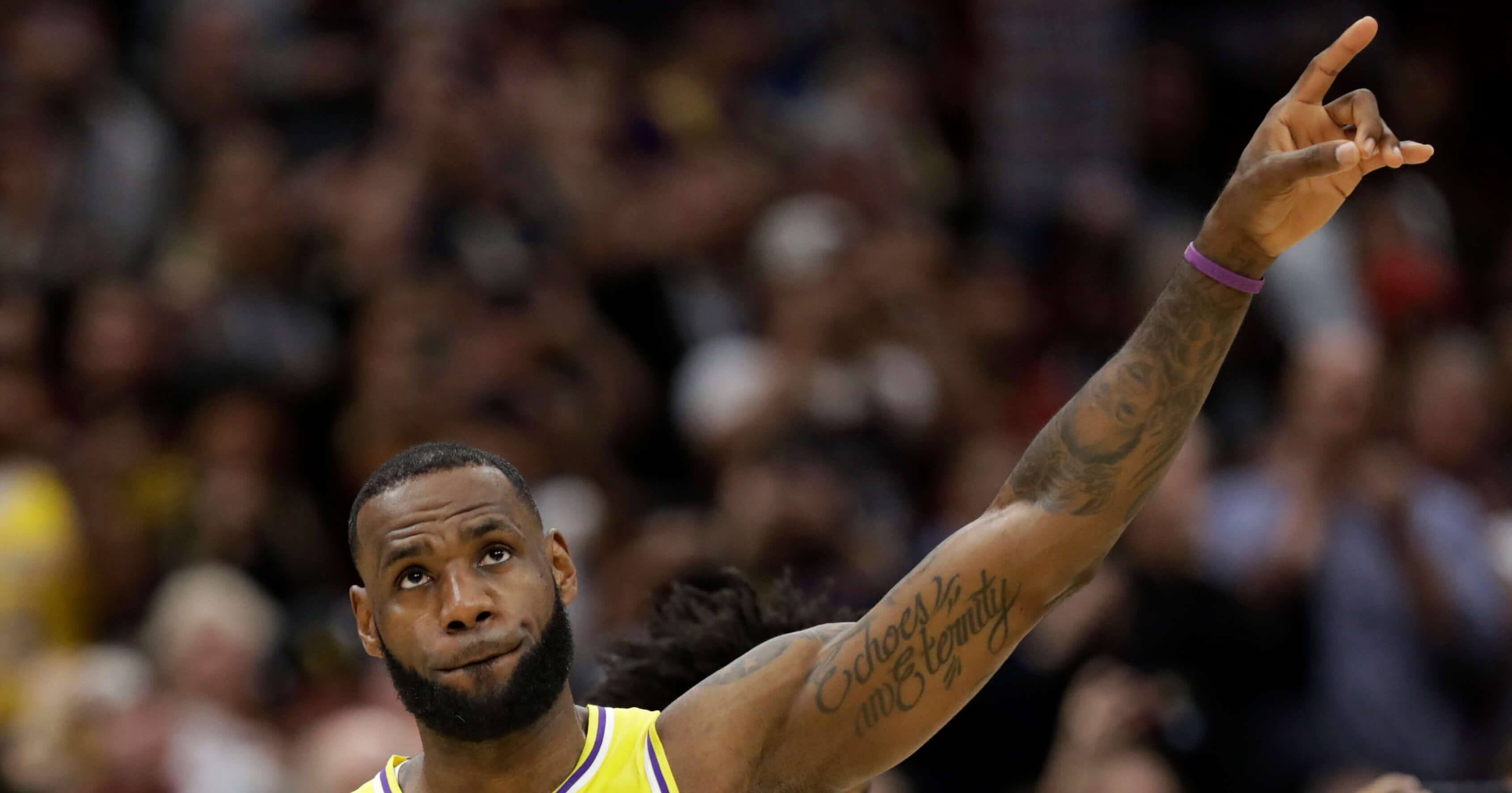 Los Angeles Lakers' LeBron James acknowledges the Cleveland fans during a video tribute to James during the first half of the game between the Lakers and the Cavaliers on Wednesday in Cleveland.