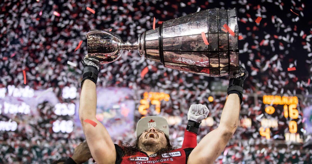 Calgary Stampeders' Alex Singleton hoists the Grey Cup after the Stampeders defeated the Ottawa Redblacks during the Canadian Football League championship game on Sunday.