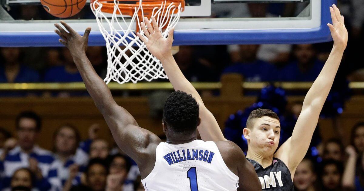 Duke's Zion Williamson (1) drives to the basket against Army's Ben Kinker (30) Sunday in Durham, North Carolina.