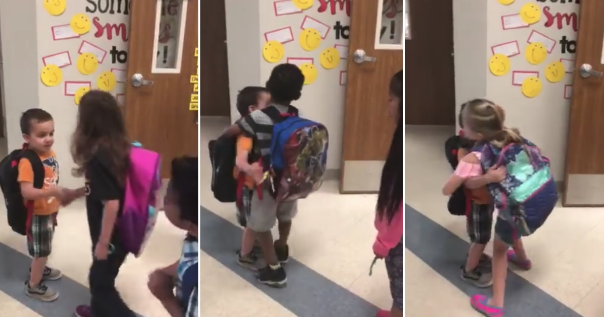 A kindergartner greets his classmates.
