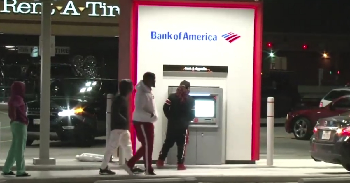 People at an ATM that accidentally gave out too much money.