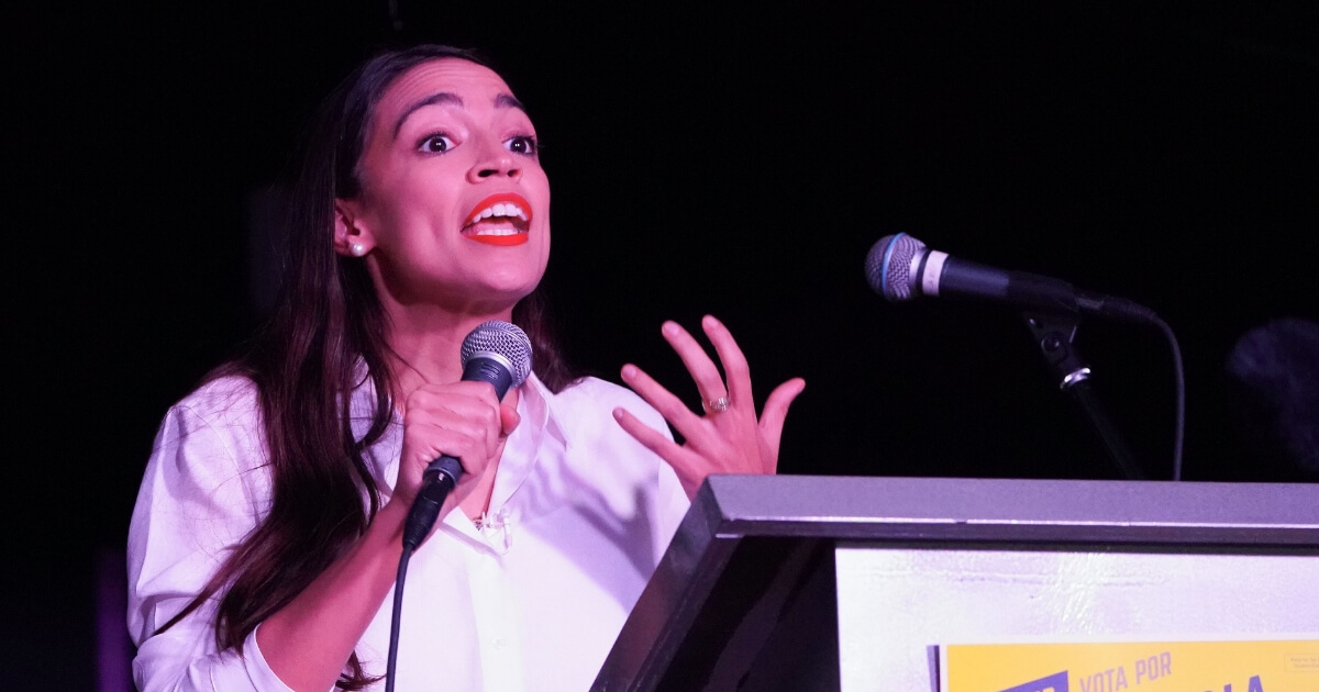 Alexandria Ocasio-Cortez addresses the crowd gathered at La Boom night club in Queens on Nov. 6, 2018, in New York City.