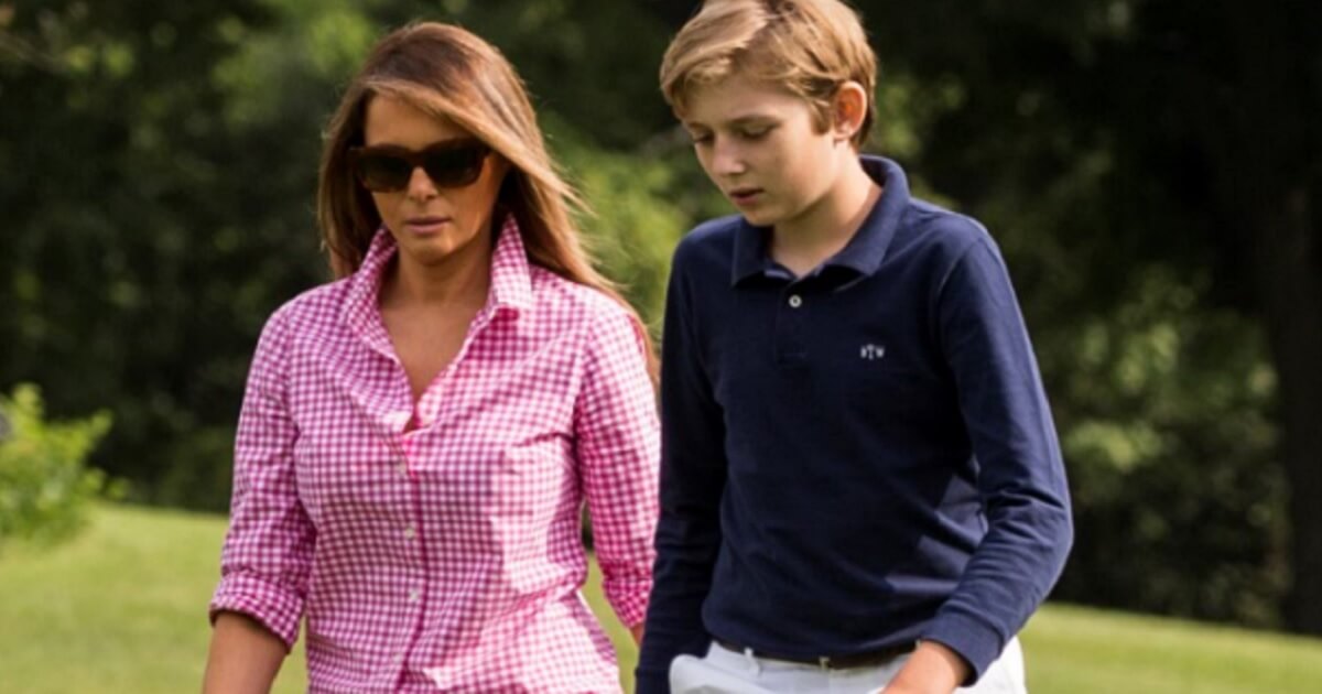 First lady Melania Trump walks with her son, Barron, on a return to the White House in August 2017.