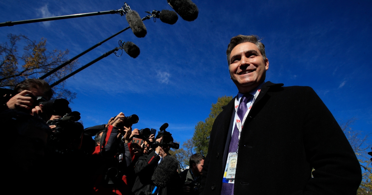 CNN's Jim Acosta speaks to journalists on the North Lawn upon returning back to the White House in Washington, Nov. 16, 2018.