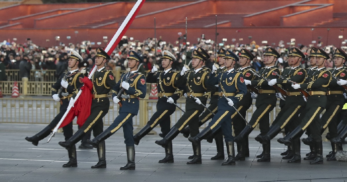 Chinese officers march in a flag-raising ceremony in Beijing in January.