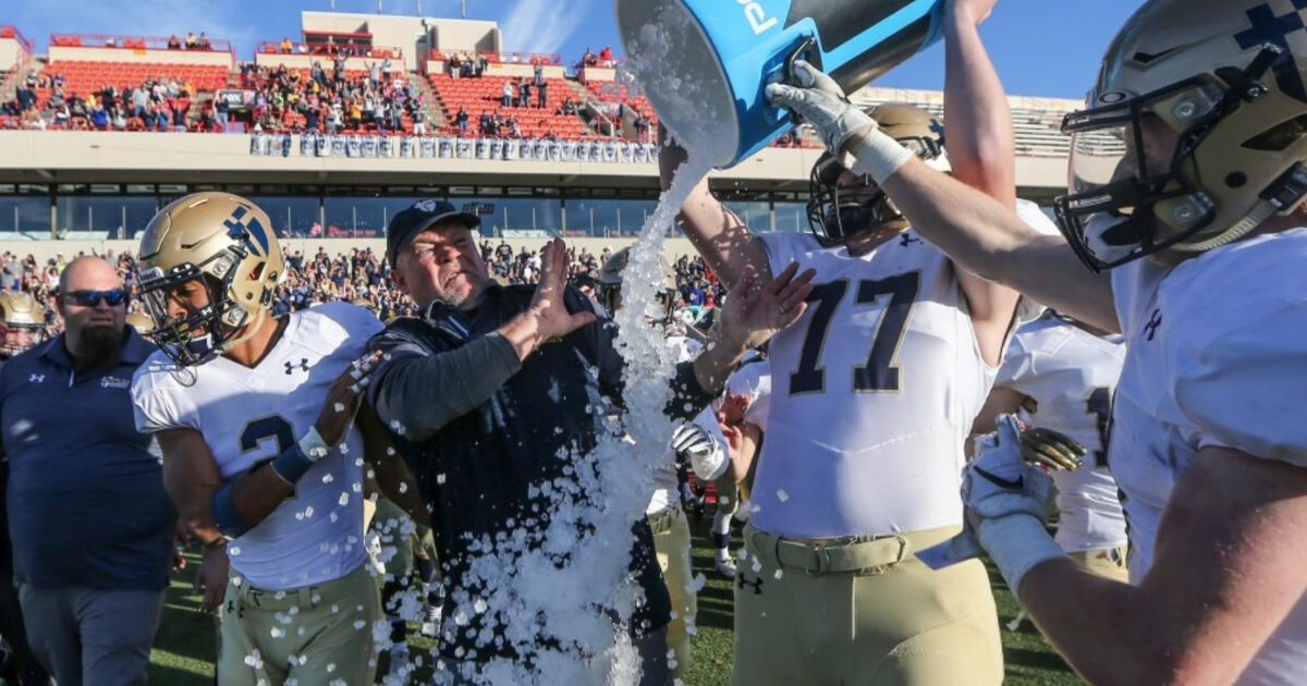 Coach Randy Dreiling wasn't happy about the ice bath he received from players after St. Thomas Aquinas of Kansas won the school’s first state football title.