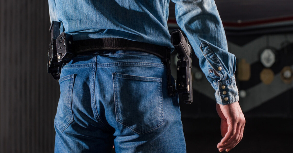 A man with a holstered gun