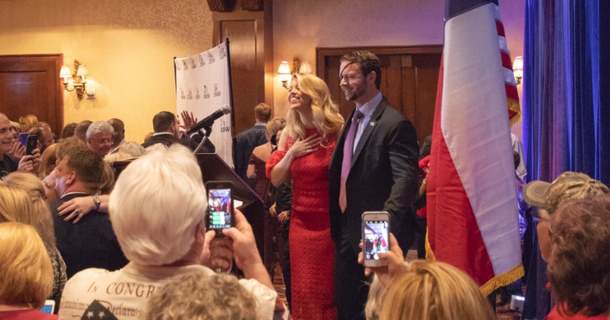 Former Navy SEAL Dan Crenshaw celebrates his victory in the 2nd Congressional District race Tuesday night.