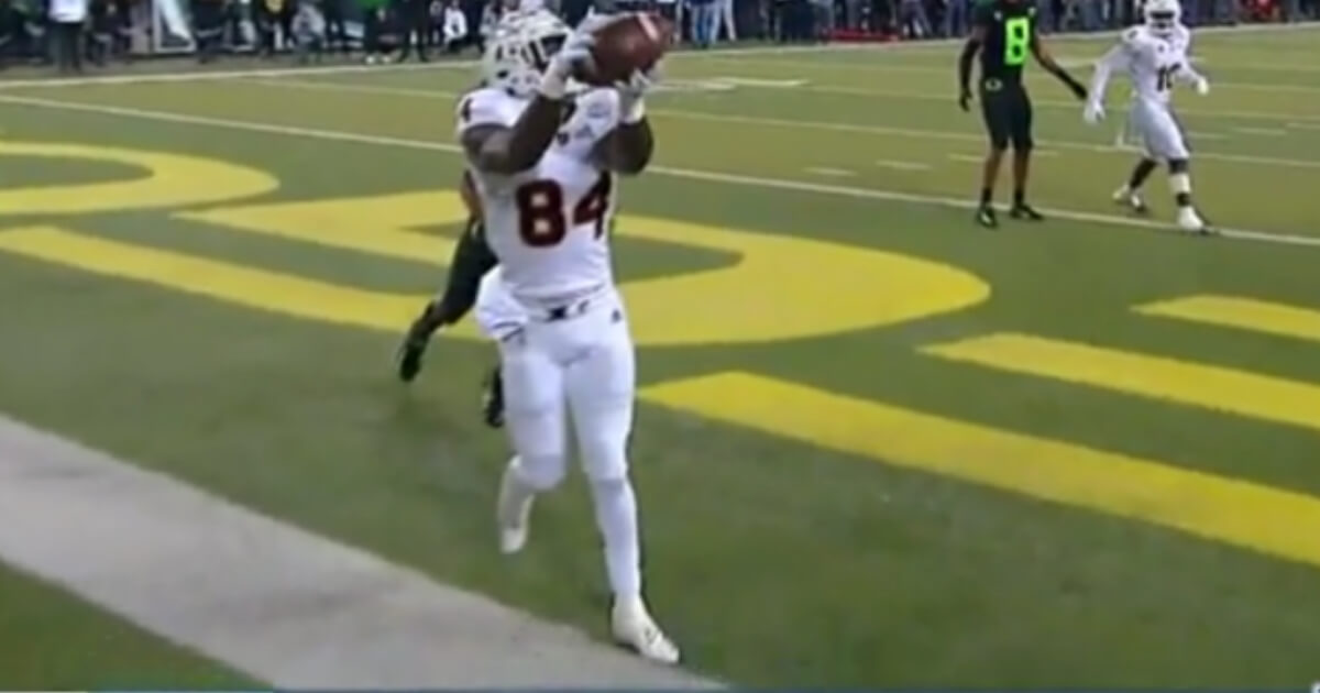 Arizona State's Frank Darby tries to keep his foot inbounds on a catch