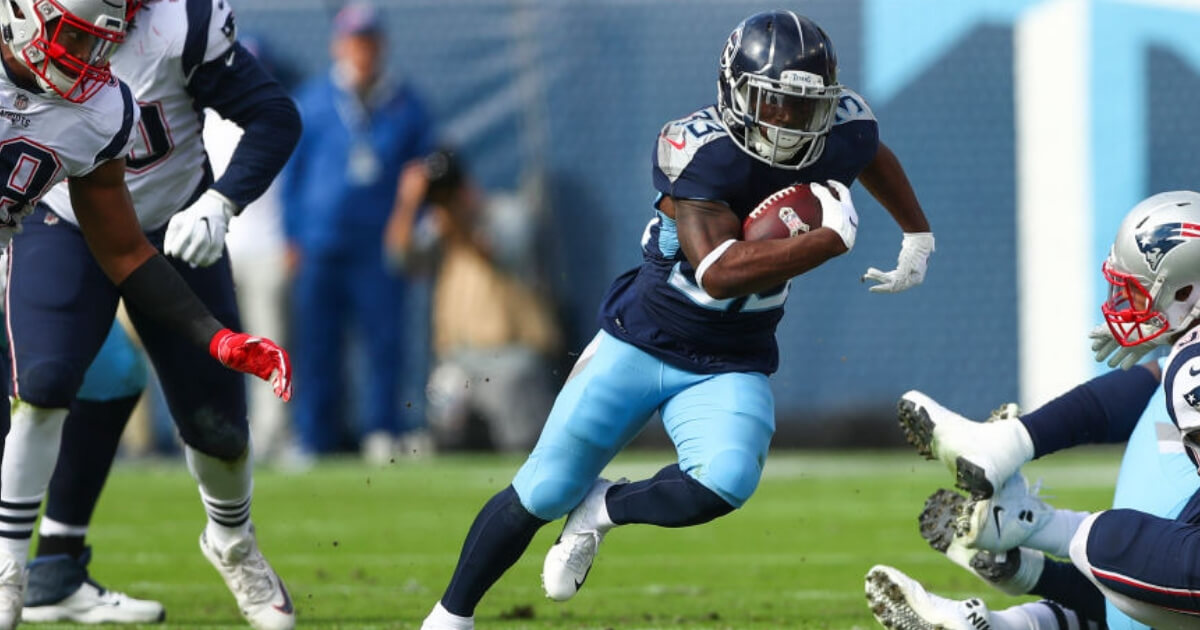 Tennessee's Dion Lewis carries the ball against his former team, the New England Patriots