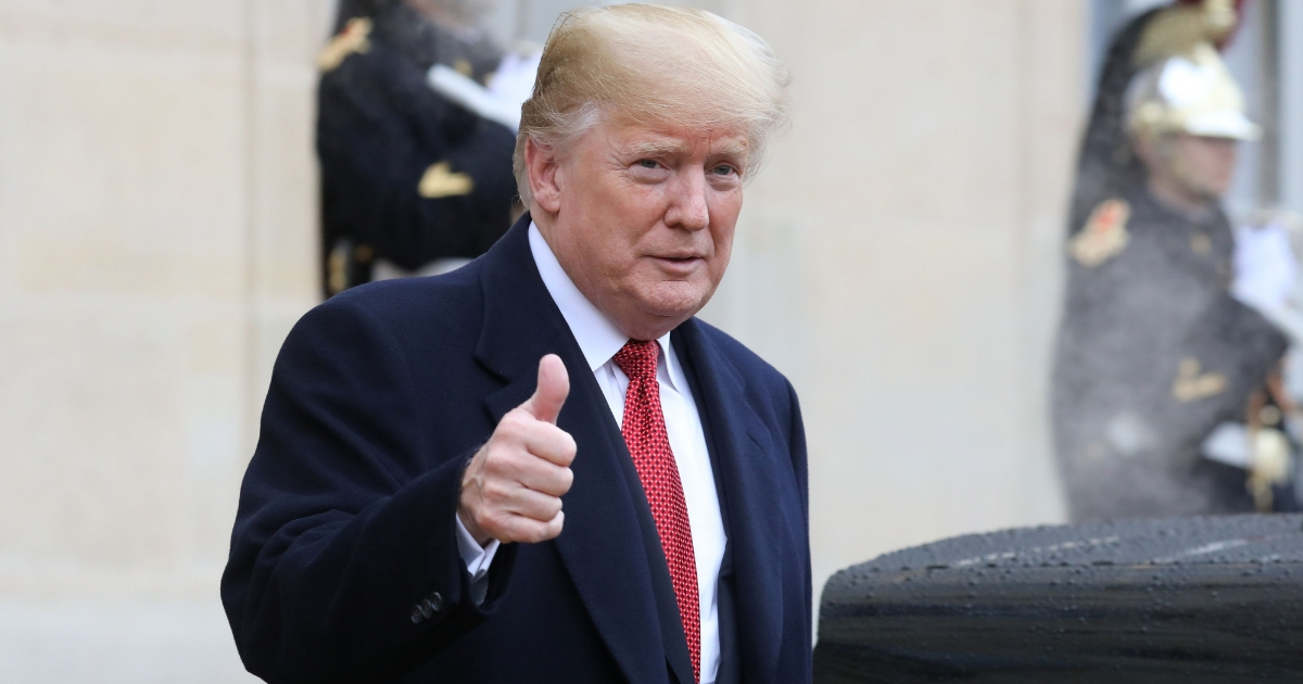 President Donald Trump gives a thumbs up as he leaves the Elysee Palace in Paris on Nov. 10, 2018.