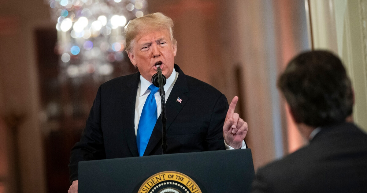 U.S. President Donald Trump gets into an exchange with CNN reporter Jim Acosta